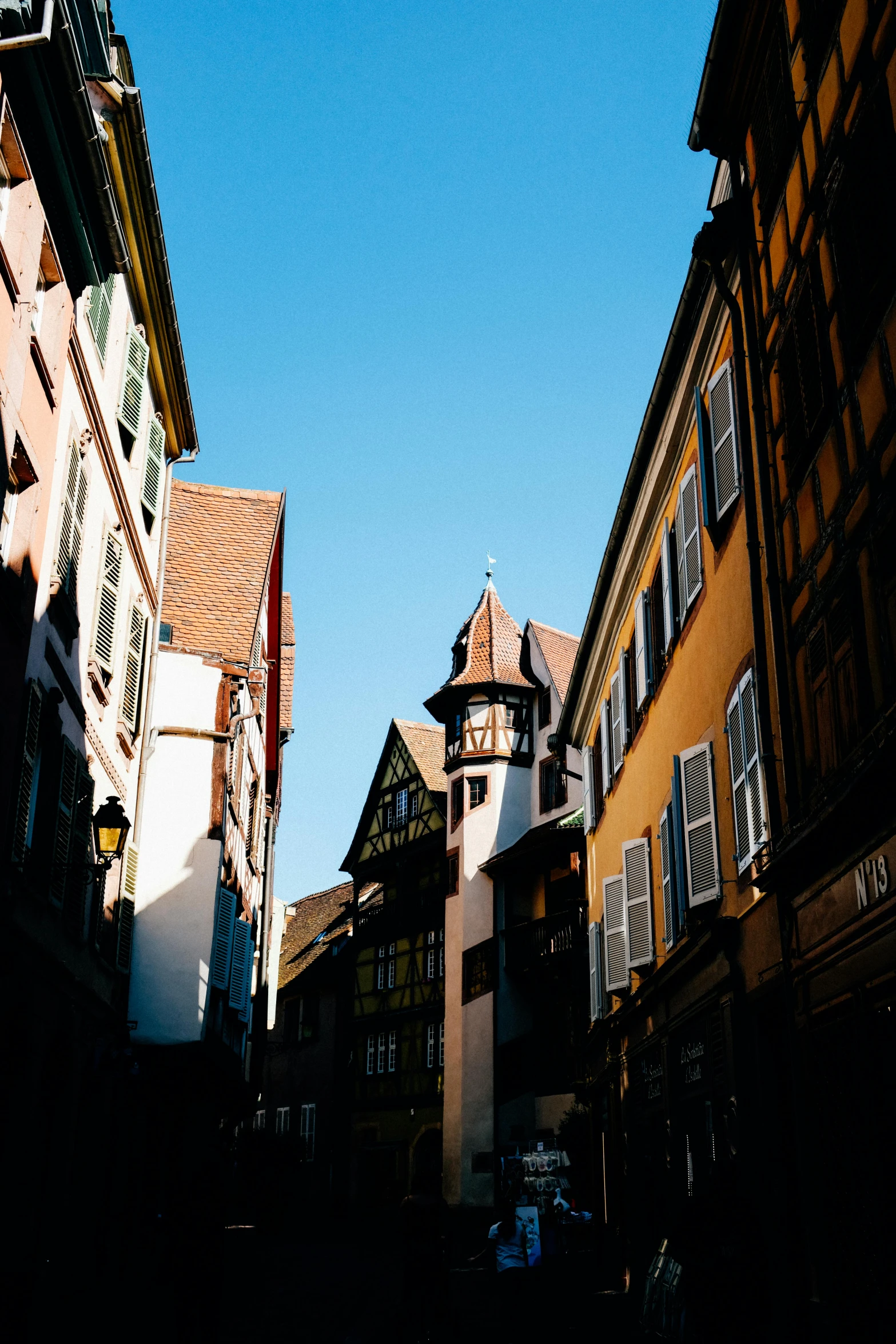 a couple of buildings that are next to each other, unsplash, renaissance, french village exterior, overexposed sunlight, square, german renaissance architecture