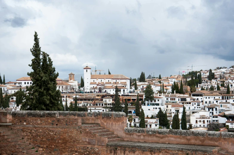 a view of a town from the top of a hill, inspired by Serafino De Tivoli, trending on unsplash, renaissance, white wall complex, spanish princess, background image