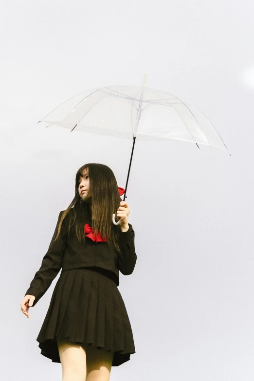 a woman in a black dress holding an umbrella, an album cover, inspired by Ayako Rokkaku, unsplash, dressed as schoolgirl, clear outfit design, cosplay photo, profile image