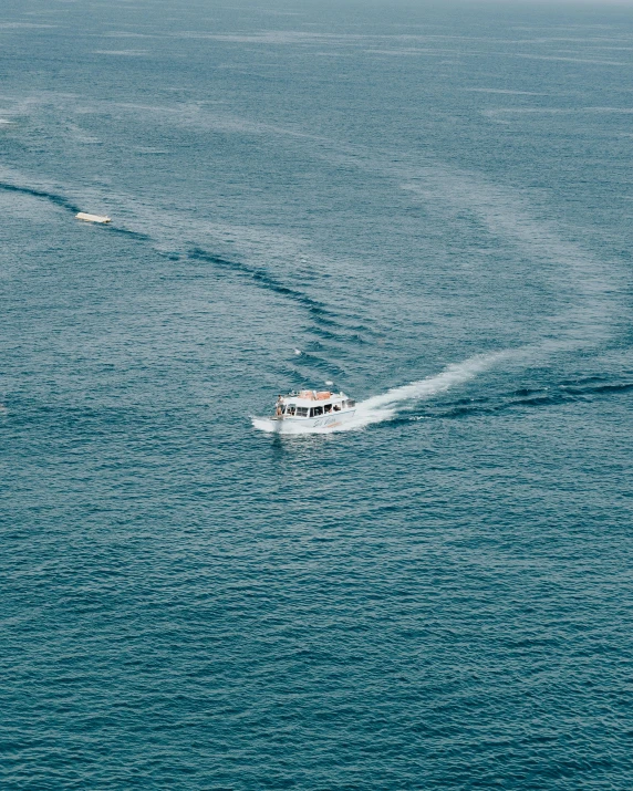 a couple of boats that are in the water, pexels contest winner, middle of the ocean, thick blue lines, thumbnail, grainy