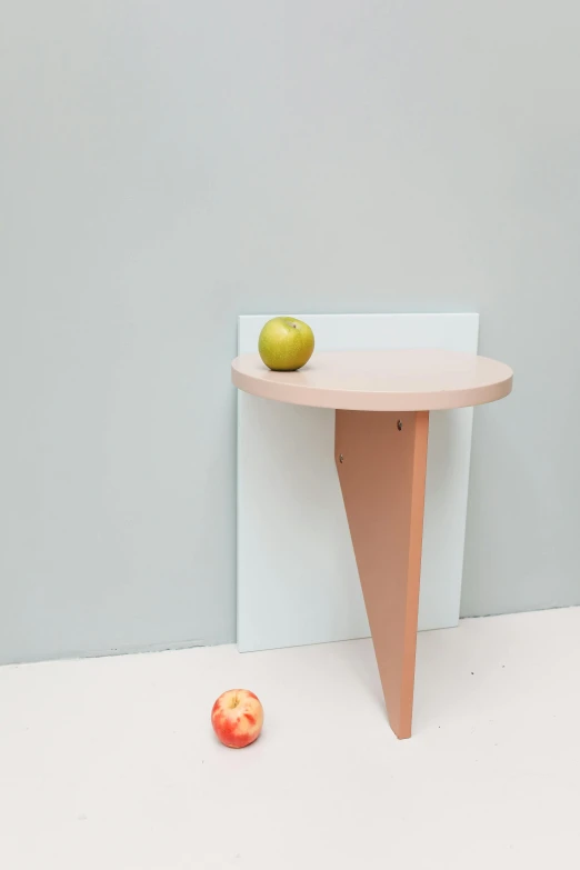 an apple sitting on top of a wooden table, by Ottó Baditz, new objectivity, pastel pink concrete, shelf, laura watson, knee