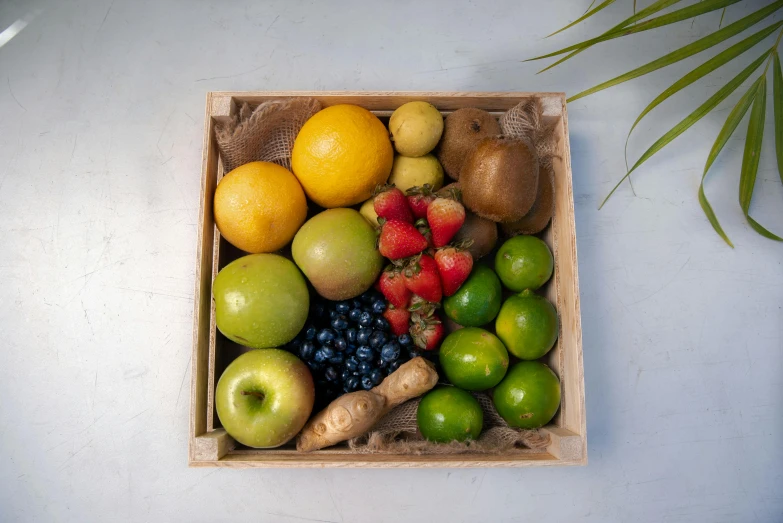 a wooden box filled with assorted fruits, inspired by Eden Box, medium level shot, full-body, greens), frontal shot