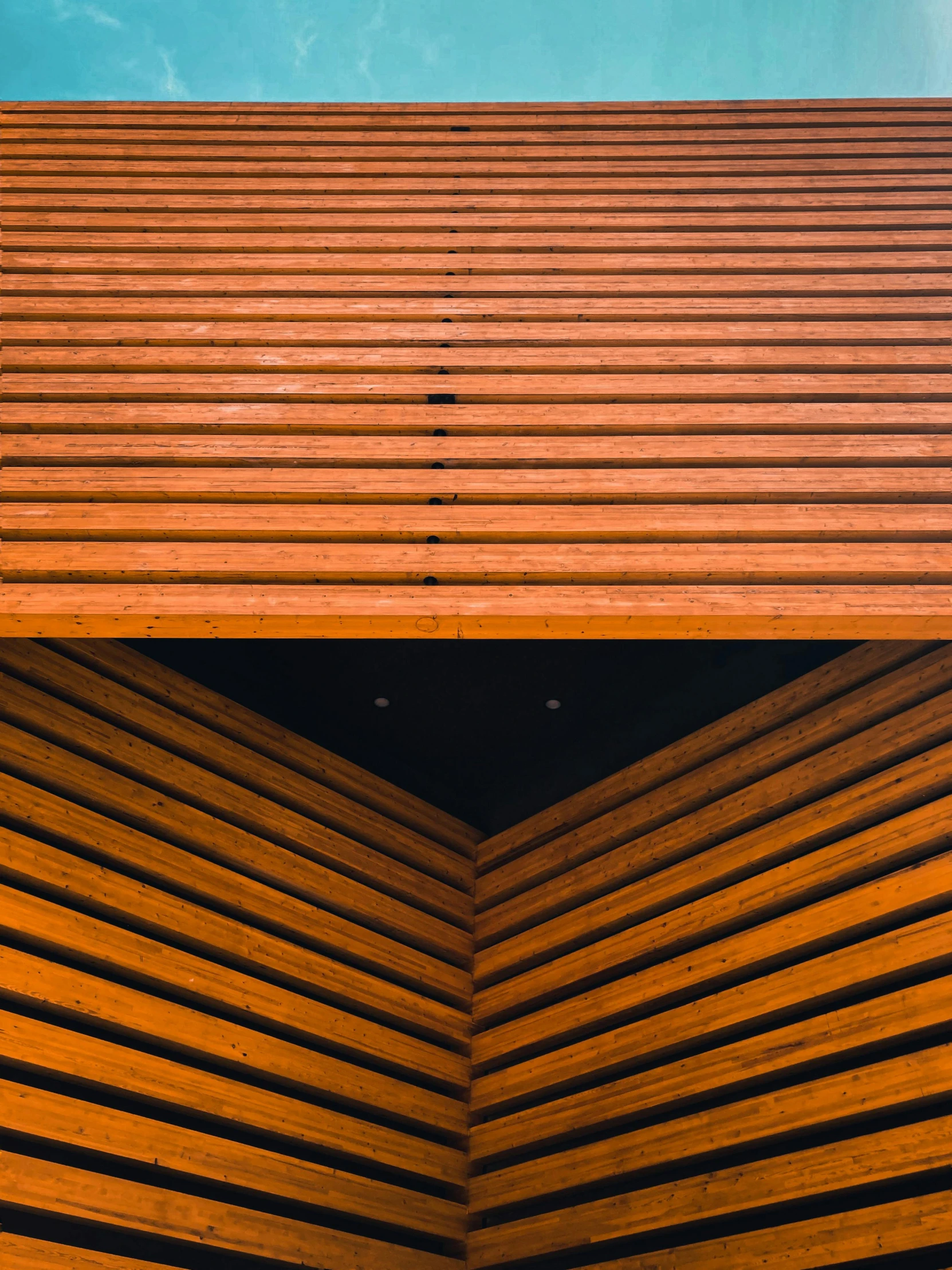 a wooden structure with a blue sky in the background, inspired by Andreas Gursky, pexels contest winner, postminimalism, diptych, black and orange, clean detail 4k, (night)