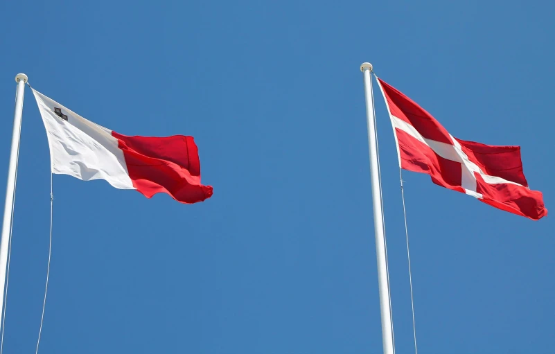 a couple of flags flying next to each other, by karlkka, pexels, hurufiyya, danish flag, square, fins, profile image