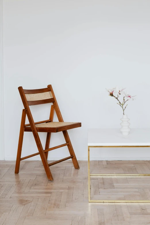 two chairs and a table in a room, an album cover, inspired by Constantin Hansen, unsplash, arte povera, full view blank background, straight neck, ƒ/5.6, wicker chair