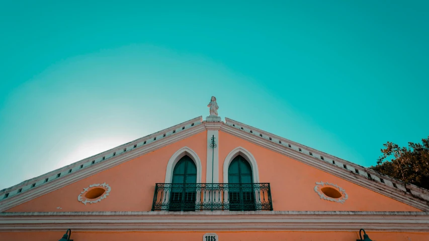 a pink building with a blue sky in the background, pexels contest winner, neoclassicism, orange and teal color, aruba, high arched ceiling, atmospheric photo