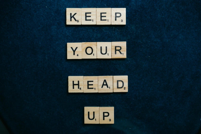 scrabbles spelling keep your head up on a blue background, an album cover, by Jesper Knudsen, unsplash, happening, profile picture, covid, inspirational quote, repetition