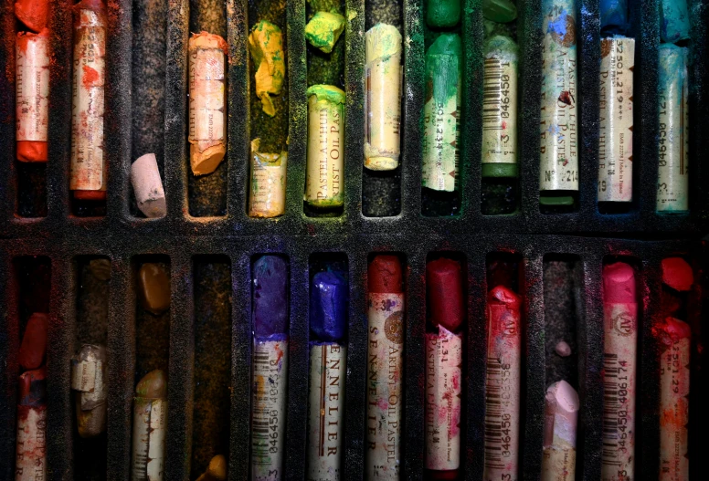 a box filled with lots of different colored crayons, a photorealistic painting, inspired by Jim Dine, pexels, process art, with cinematic colour palette, urban decay, test tubes, rich deep colors. masterpiec