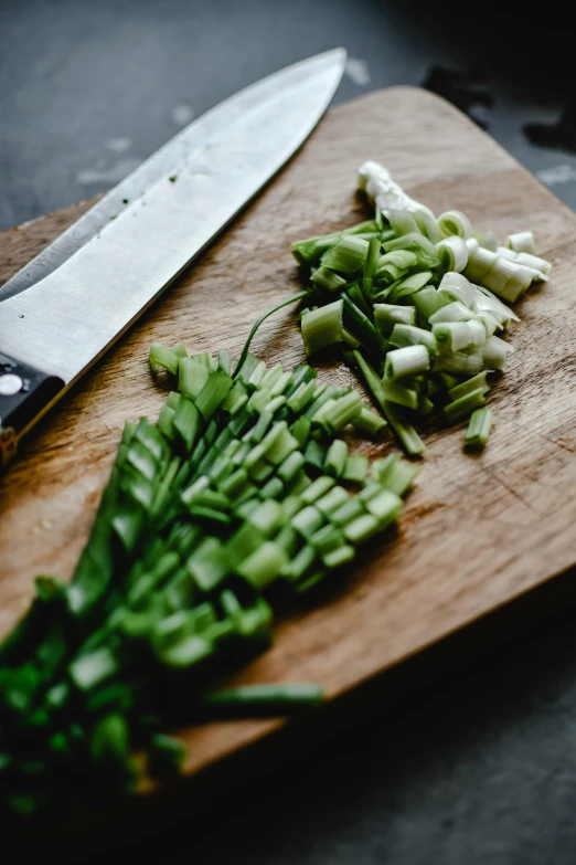 chopped green vegetables on a cutting board next to a knife, pexels, renaissance, orchid stems, multiple stories, paul barson, stew