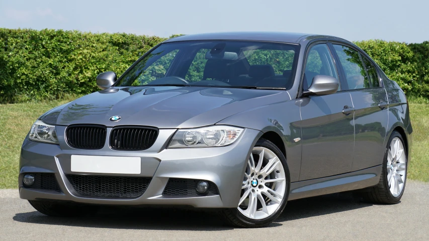 a silver car parked on the side of the road, bmw, gunmetal grey, 2263539546], detailing