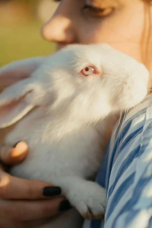 a woman holding a white rabbit in her arms, trending on unsplash, close - up of face, 15081959 21121991 01012000 4k, made of lab tissue, pastel'