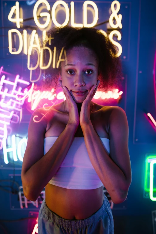 a woman standing in front of neon signs, trending on pexels, mixed race woman, posing for a picture, white neon, black teenage girl