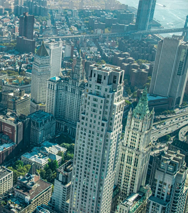 a view of a city from the top of a building, by Sam Dillemans, pexels contest winner, art nouveau, manhatten on top of skyscrapers, square, frank gehry, 15081959 21121991 01012000 4k