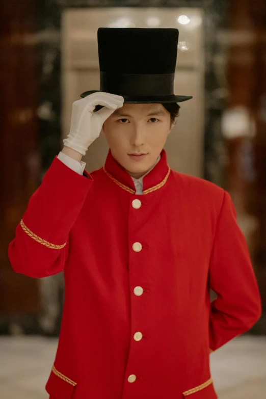 a man in a red uniform adjusts his hat, an album cover, shin hanga, luxurious suit, androgynous person, looking straight to camera, gentlemens dinner