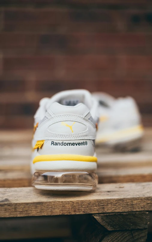 a pair of shoes sitting on top of a wooden bench, inspired by Graham Forsythe, half pikachu, triple white colorway, zoomed in shots, pandemonium