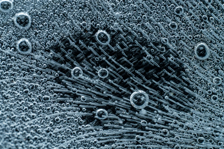 a close up of a bunch of water bubbles, a stipple, by Adam Marczyński, unsplash, digital art, hyperdetailed metalwork, carbon fibers, highly detailed product photo, draped with water and spines