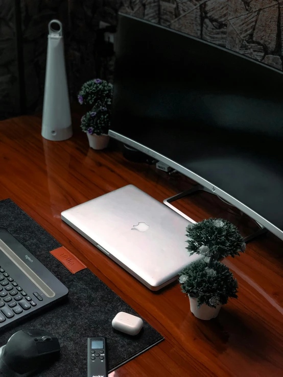 a laptop computer sitting on top of a wooden desk, satisfying cable management, profile image, no - text no - logo, half image