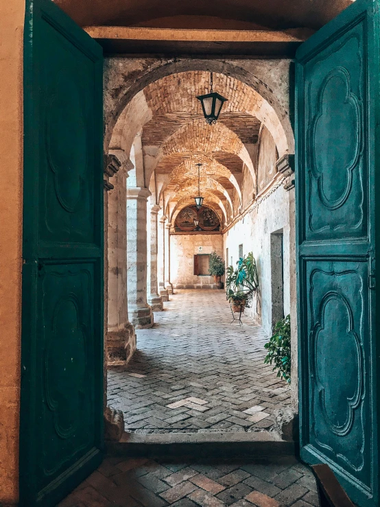 an open green door leading to a hallway, inspired by Luis Paret y Alcazar, pexels contest winner, romanesque, photo of penelope cruz, conversano, panoramic, 2 5 6 x 2 5 6 pixels