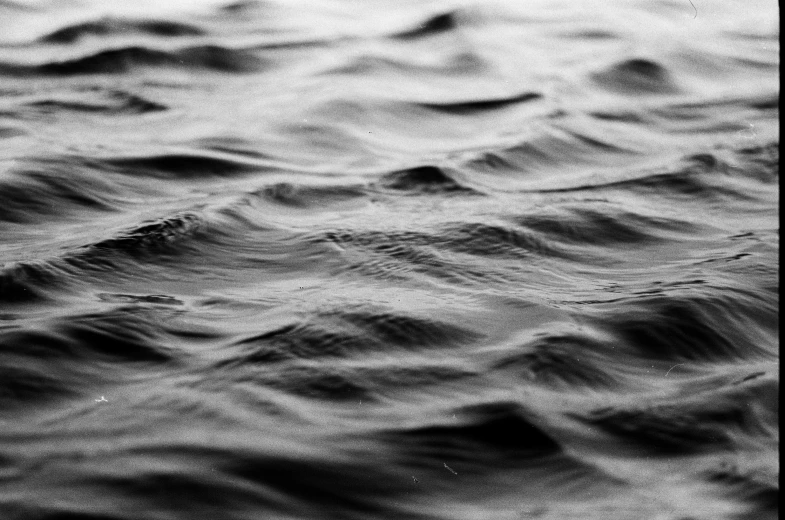 a black and white photo of a body of water, pexels, lyrical abstraction, swirly vibrant ripples, horizon line focus, hd detailed texture, monochrome:-2