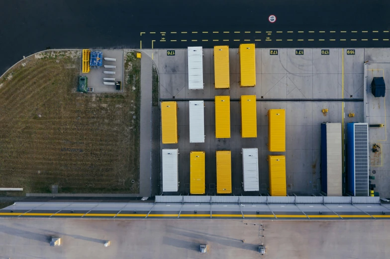 a parking lot filled with lots of yellow and white boxes, a portrait, pexels contest winner, shipping docks, johannes vemeer, 🦑 design, thumbnail