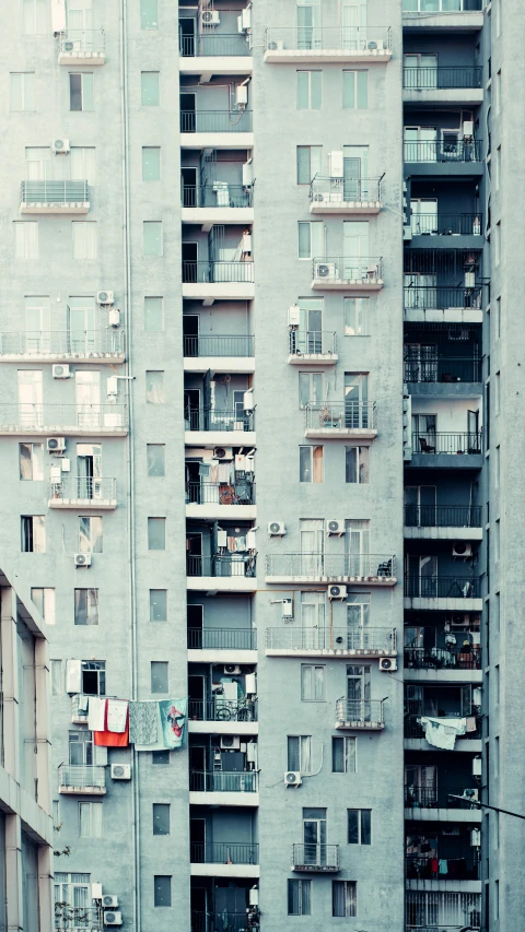 a couple of tall buildings sitting next to each other, inspired by Elsa Bleda, pexels contest winner, brutalism, balcony scene, 15081959 21121991 01012000 4k, settlement, cooling