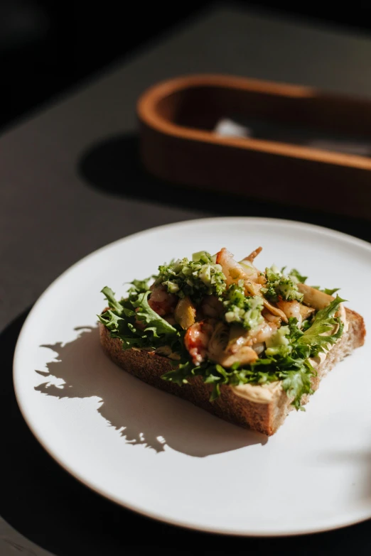 a close up of a plate of food on a table, a portrait, inspired by Richmond Barthé, unsplash, sandwich, sprouting, a blond, ignant