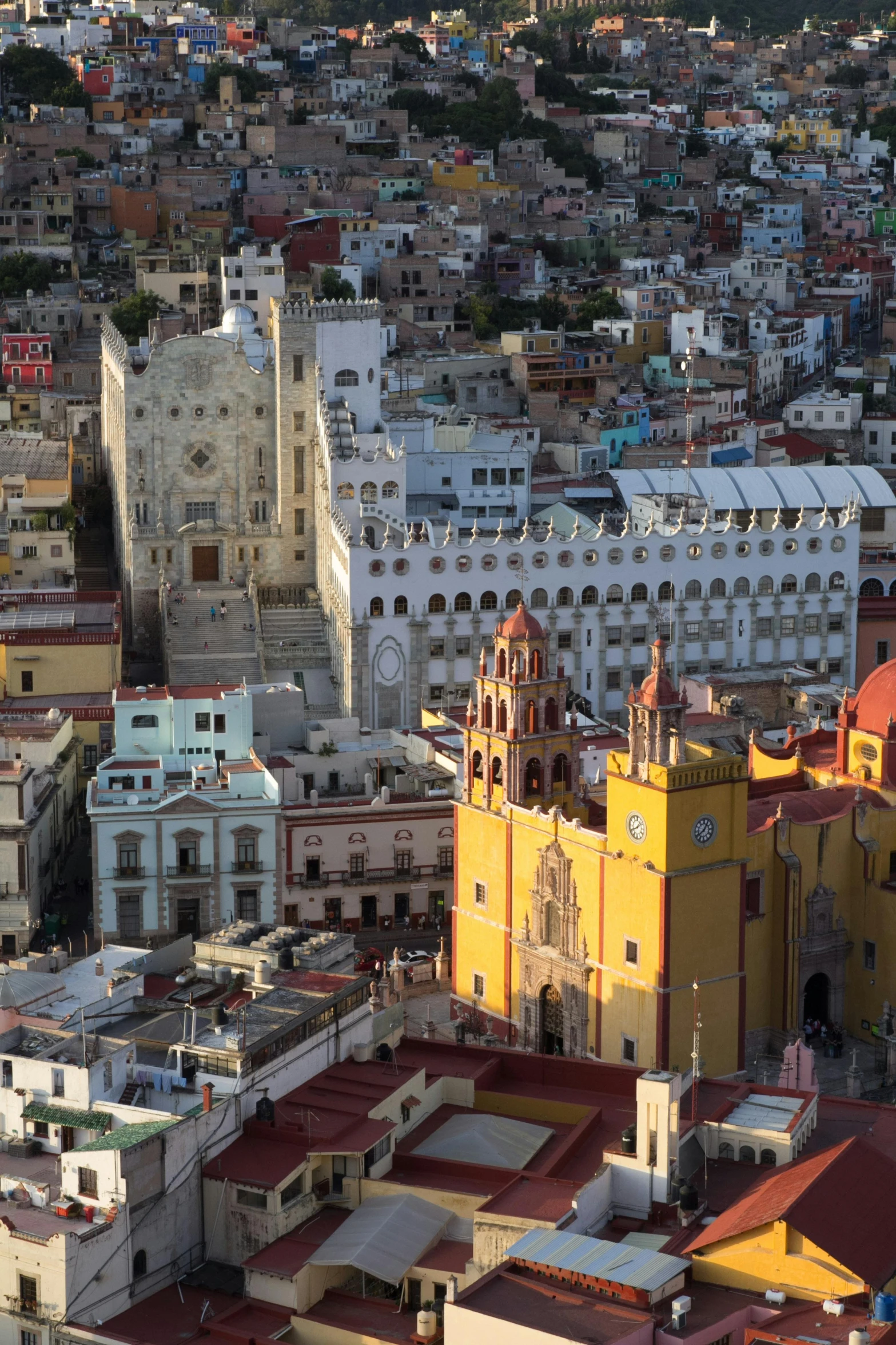 a view of a city from a bird's eye view, by Jean Xceron, guanajuato, full morning sun, square, 8 k hi - res