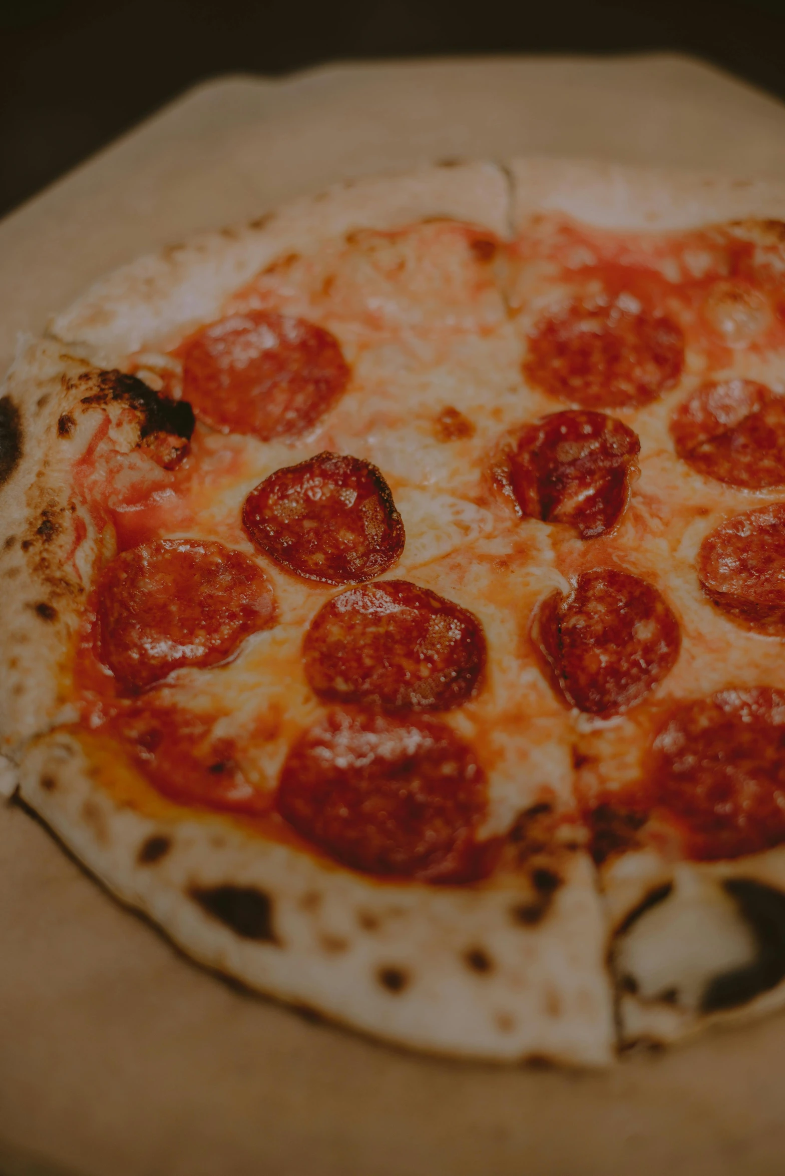 a pepperoni pizza sitting on top of a pizza pan, by Tom Bonson, pexels contest winner, renaissance, made of glazed, smol