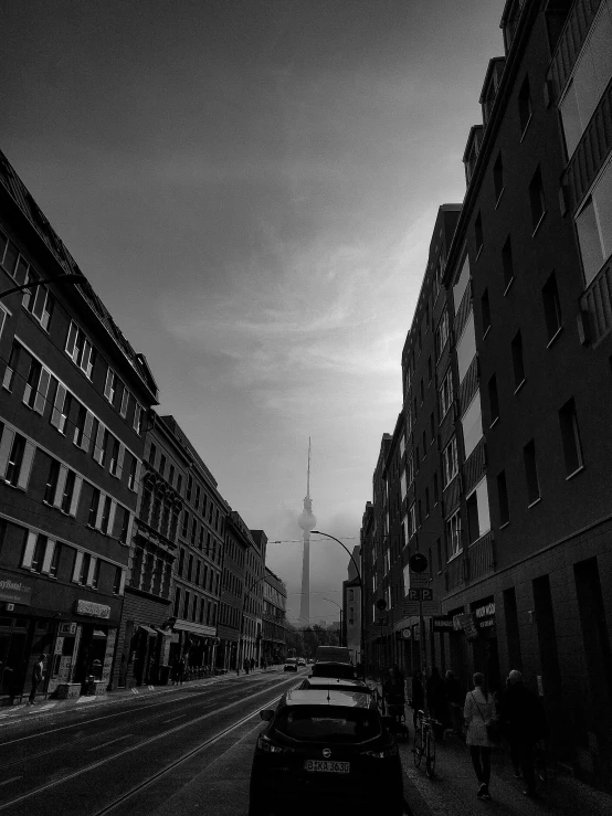 a black and white photo of a city street, by Adam Rex, the shard, stockholm, spire, leica s photograph