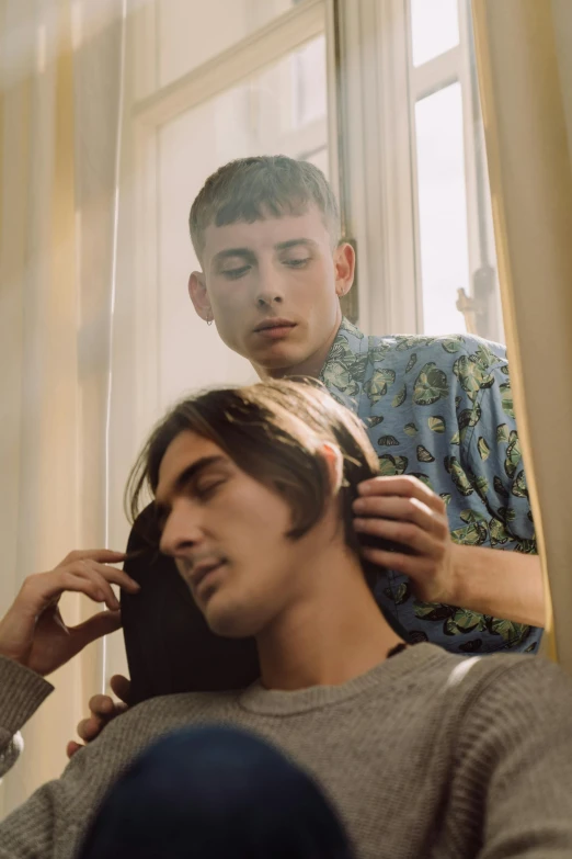 a young man combing another young man's hair, an album cover, by Nathalie Rattner, trending on pexels, still from a music video, lily frank, head and shoulders, lush