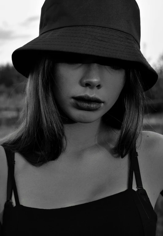 a black and white photo of a woman wearing a hat, inspired by Max Dupain, tumblr, realism, 🤤 girl portrait, bella poarch, duckface, anna nikonova aka newmilky