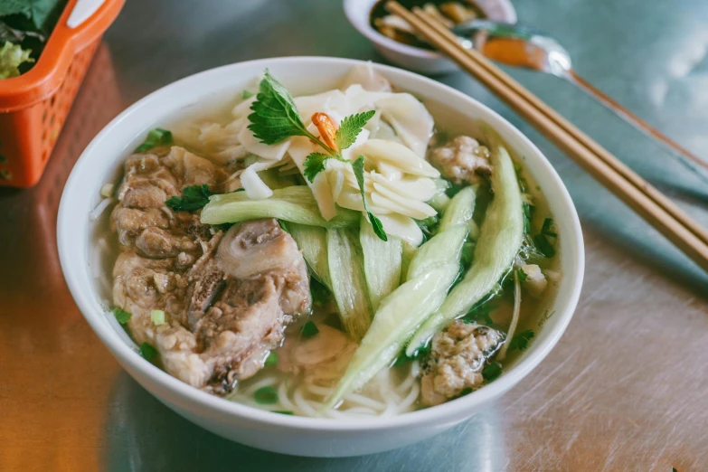 a close up of a bowl of food on a table, inspired by Tan Ting-pho, square, white, chicken, sunny sky