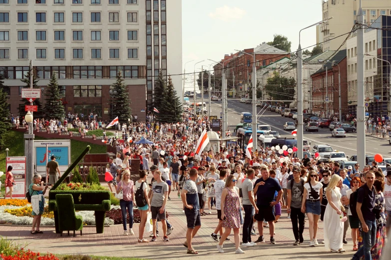 a large group of people walking down a street, artyom turskyi, patriotism, instagram post, fan favorite