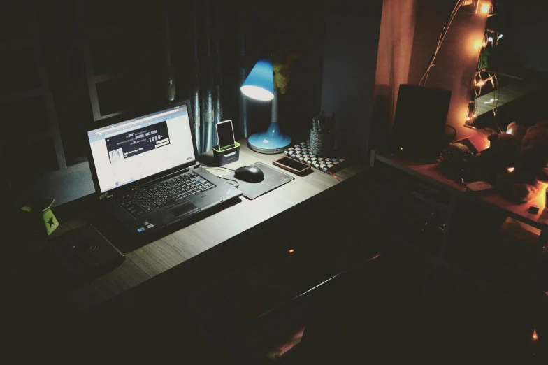 a laptop computer sitting on top of a wooden desk, a picture, inspired by Elsa Bleda, happening, dark bedroom, instagram picture, rectangle, mid night