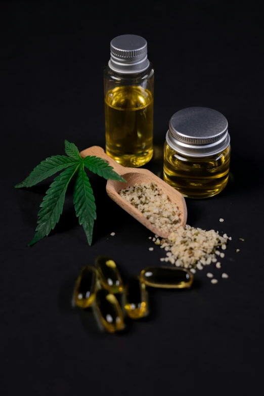 hemp oil, pills and capsules on a black background, a picture, by Jeanna bauck, shutterstock, new design, portrait shot, universal, dutch