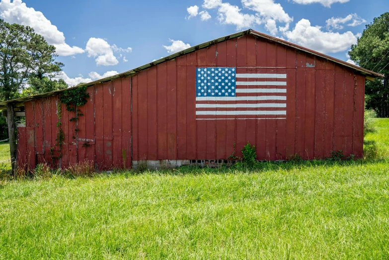 an american flag painted on the side of a red barn, unsplash, slide show, 2022 photograph, high resolution image