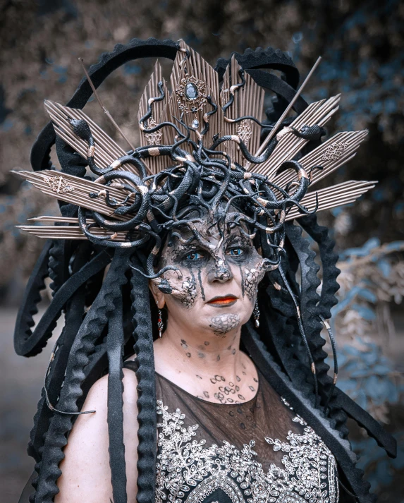 a close up of a person wearing a costume, pexels contest winner, gothic art, orgnic headpiece, lgbtq, made of intricate metal and wood, the oracle of trees