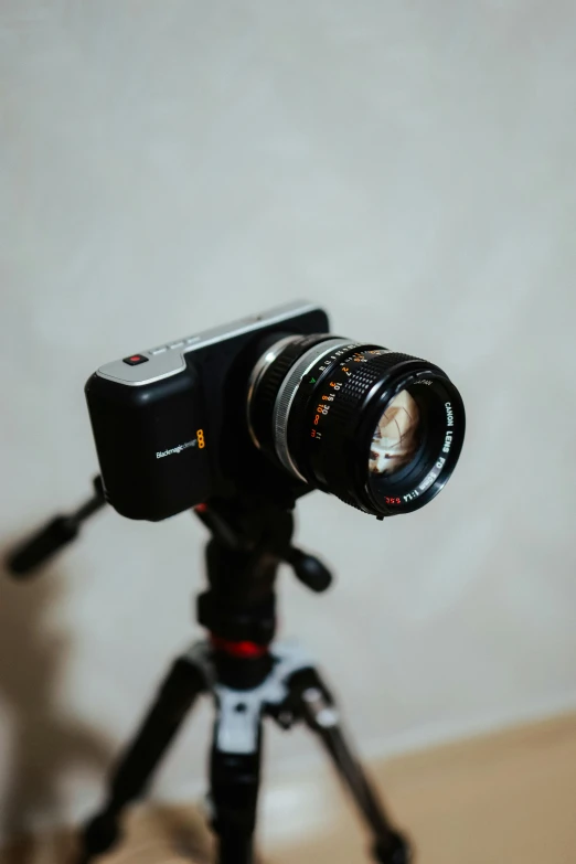 a close up of a camera on a tripod, unsplash, photorealism, hasselblad medium format, home video footage, alexa mini, looking directly at the camera