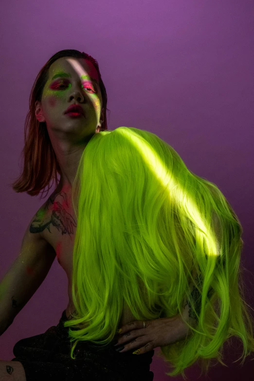 a woman with bright green hair posing for a picture, an album cover, inspired by Elsa Bleda, trending on pexels, yellow purple green, attractive androgynous humanoid, bisexual lighting, chris cunningham