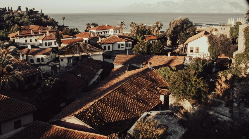 a view of a town from the top of a hill, pexels contest winner, tiled roofs, theophanes, 2 0 0 0's photo, near the beach