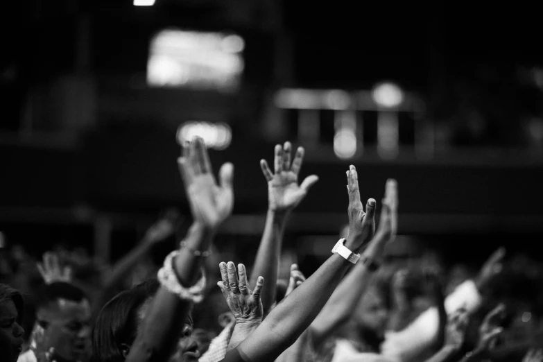 a crowd of people raising their hands in the air, a black and white photo, by Matija Jama, pexels, hurufiyya, prayer hands, 15081959 21121991 01012000 4k, contain, promo image
