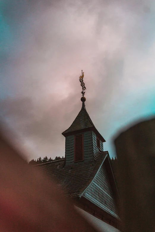 a cup of coffee sitting on top of a wooden table, an album cover, by Jacob Toorenvliet, pexels contest winner, symbolism, church in the wood, overcast dusk, cyberpunk church, snapchat photo