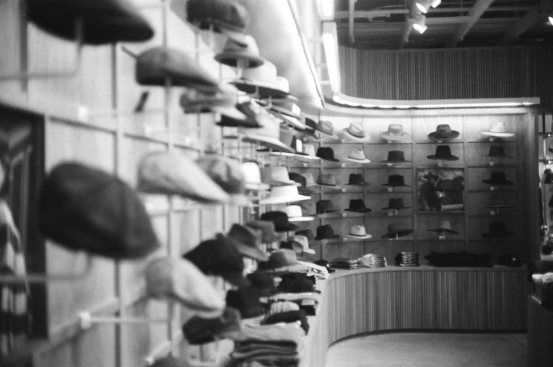 a black and white photo of a hat shop, a black and white photo, sneaker photo, tailored clothing, uploaded, small hat
