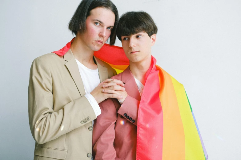 a couple of people standing next to each other, an album cover, unsplash, bauhaus, gay pride, declan mckenna, omori, patriotism