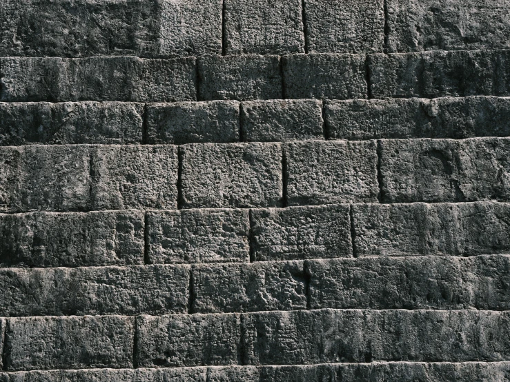 a black and white photo of a brick wall, inspired by Piranesi, unsplash, background image, tileable, brown, hyperdetailed photograph