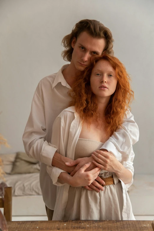 a man and a woman standing next to each other, trending on pexels, renaissance, a redheaded young woman, wearing white pajamas, soft shade, ignant