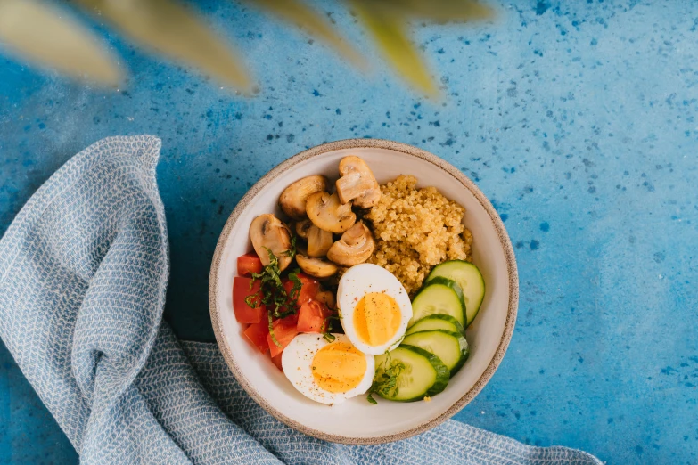 a bowl of food sitting on top of a blue table, by Julia Pishtar, pexels contest winner, lush oasis, hearty breakfast, avatar image, listing image