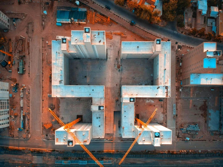 an aerial view of a building under construction, pexels contest winner, modular constructivism, symmetrical 4k, square shapes, helicopter view, white buildings