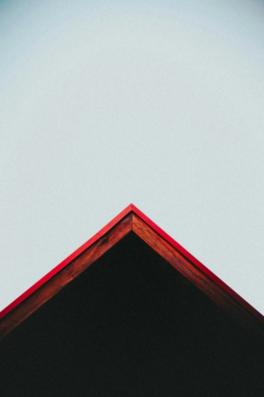 a bird sitting on top of a roof, a minimalist painting, by Carey Morris, unsplash, red trusses, angular jawline, triangle, devils