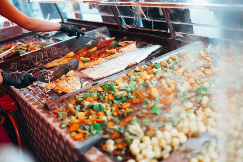 a buffet filled with lots of different types of food, pexels, realism, fish market stalls, avatar image, burned, film photo